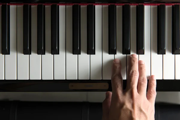 Musician hand on piano