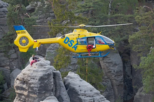 Rescue helicopter in the mountains