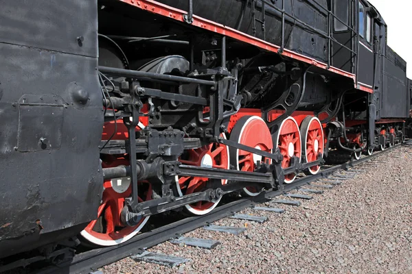 The wheels of an old steam engine