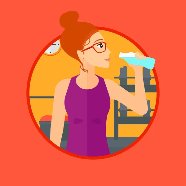 Sportive woman drinking water.
