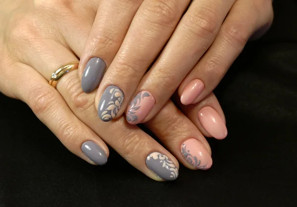 Picture manicure on female hands