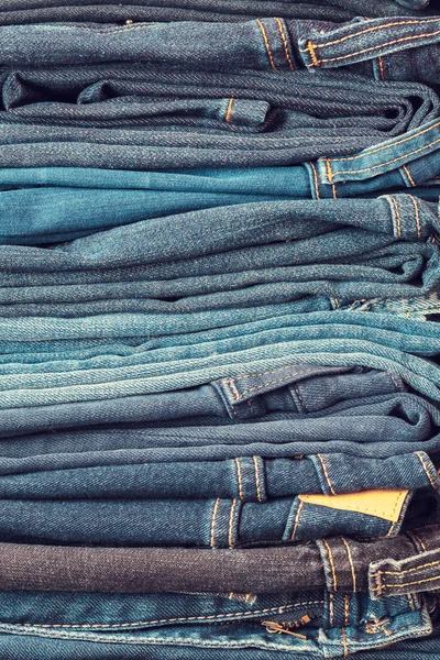 Stacked fashion blue jeans closeup