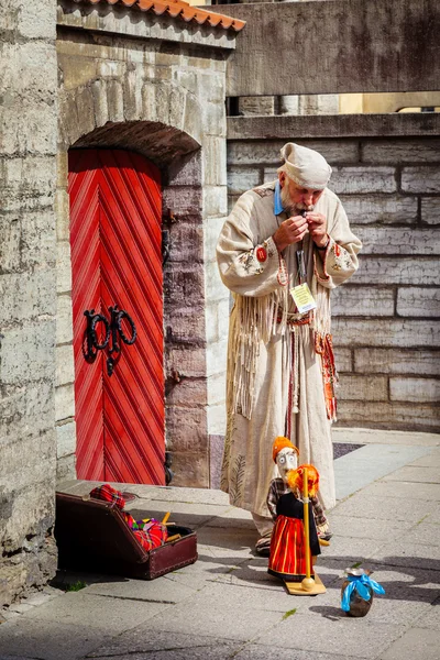 Puppet master and string marionette doll in Tallinn