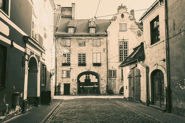 Black and white photo of medieval street in the old city of Riga
