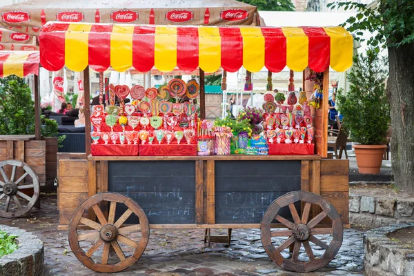 Candy shop on wooden cart for lollipops sale