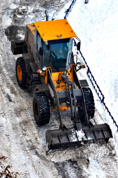 Cleaning of snow from city streets by means of special equipment