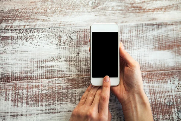 Mobile telephone in hands of  girl