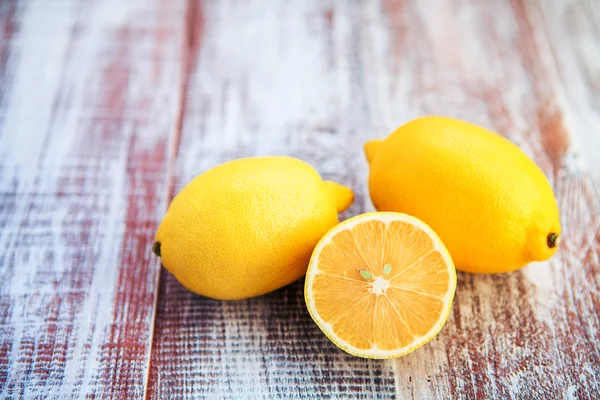 Lemon isolated on a wooden background