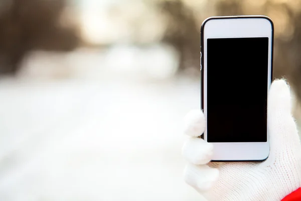 Female hand with mobile phone