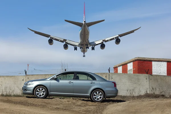 NOVOSIBIRSK - APR. 30: Airport outside. Parked car. Boeing 747-8 LX-VCB Cargolux landing at Novosibirsk Tolmachevo Airport. April 30, 2016 in Novosibirsk Russia