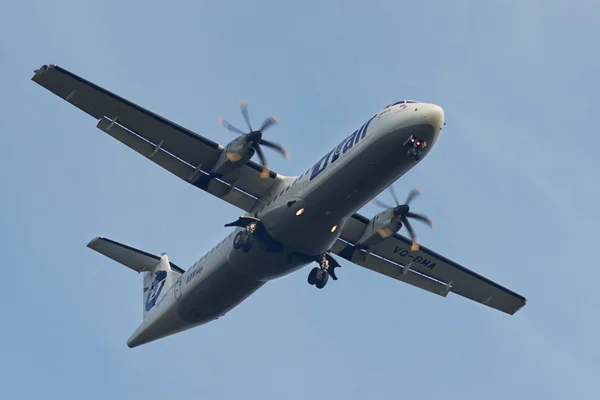 NOVOSIBIRSK - AUG 30: Aircraft operated by Utair, landing in Tolmachevo airport. The company Utair in its fleet has 22 aircraft ATR-72. August 30, 2015 in Novosibirsk Russia