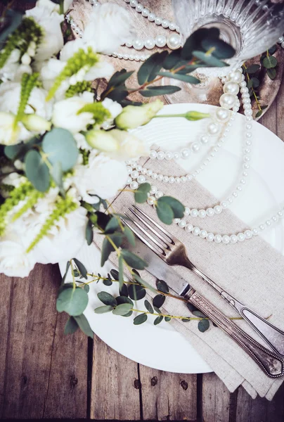 Vintage wedding table decor, tableware, flowers and pearl beads