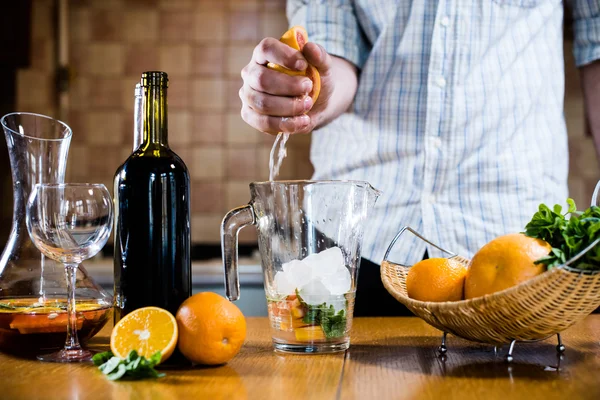 Man squeezes grapefruit juice