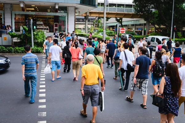 Pedestrians on famous street Orchard Road in Singapore