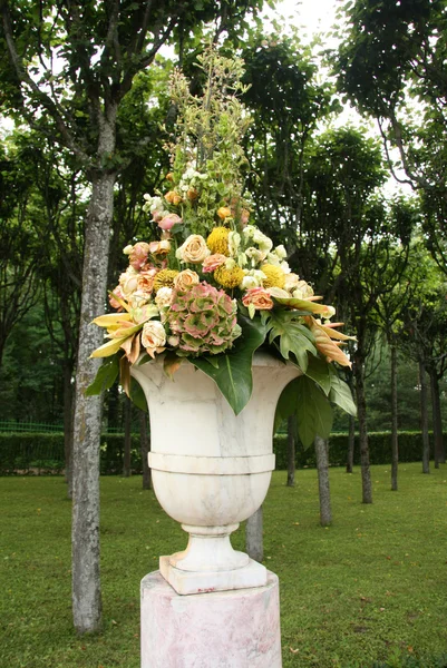 Vase with flowers in the park