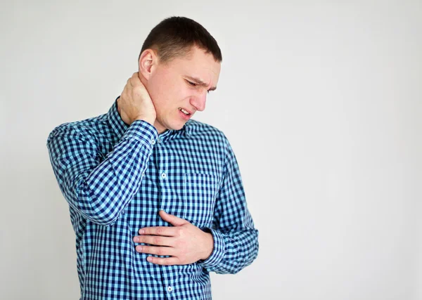 Young man having neck pain