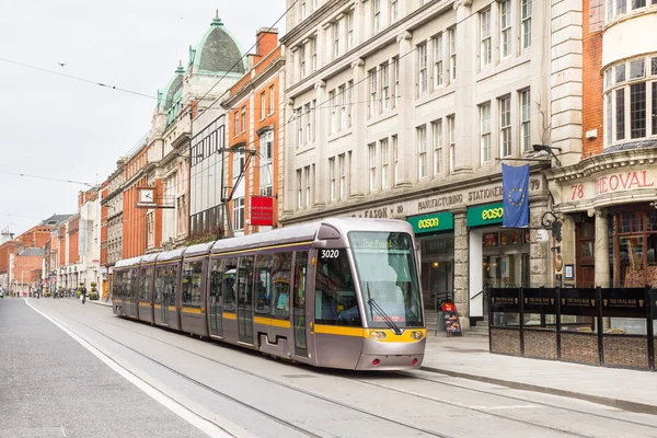 Tram crossing a road in the centre of Dublin