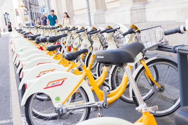 Bikes parked in racks to be used as public sharing service, Milan, Italy