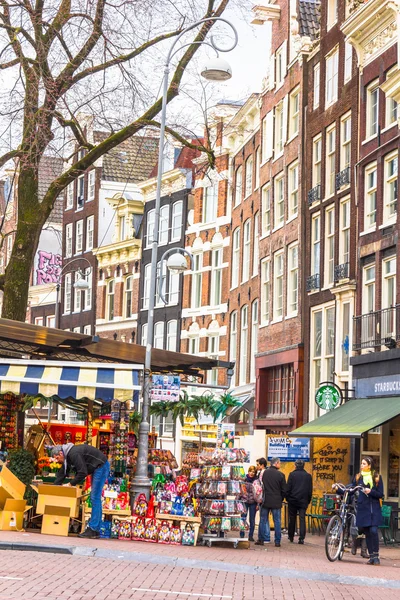 People walking in the famous flower market in Amsterdam