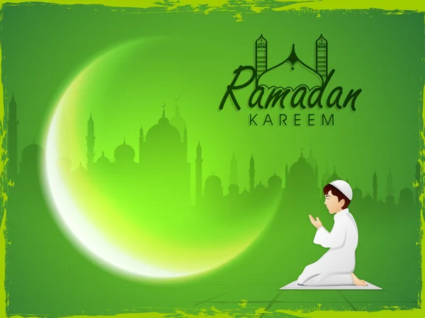 Ramadan Kareem celebration with muslim boy offering Namaz.