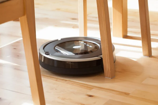 Robotic vacuum cleaner on laminate wood floor smart cleaning tec