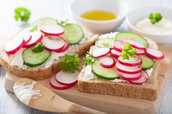 Healthy sandwich with radish cucumber and cream cheese