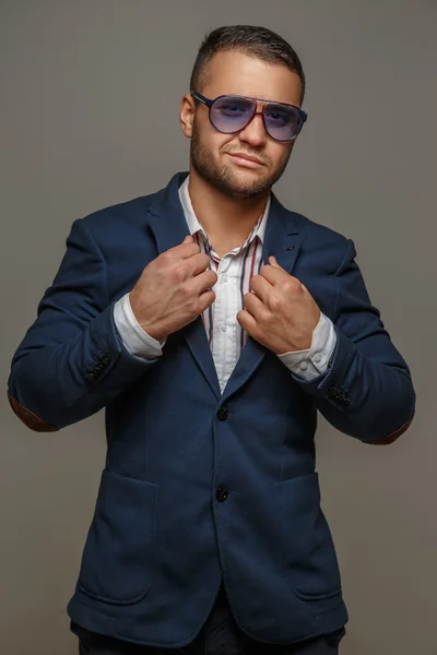Man in sunglasses and blue suit