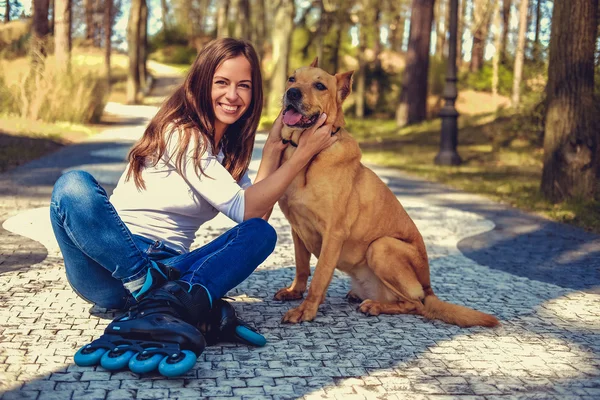 Brunette woman with brown dog