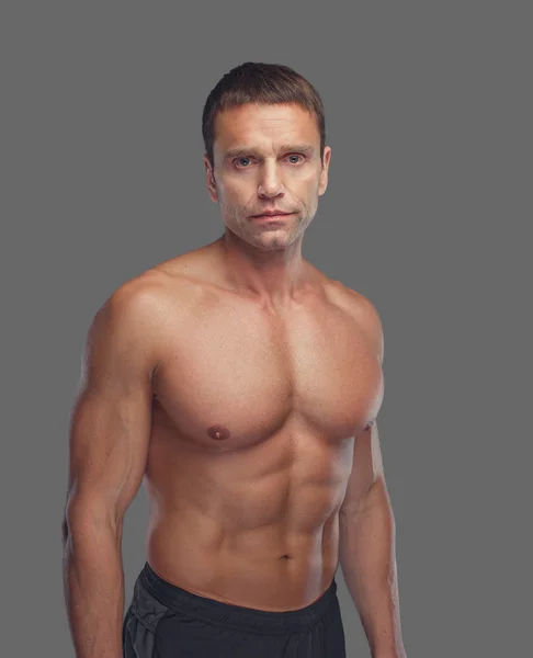Shirtless muscular male