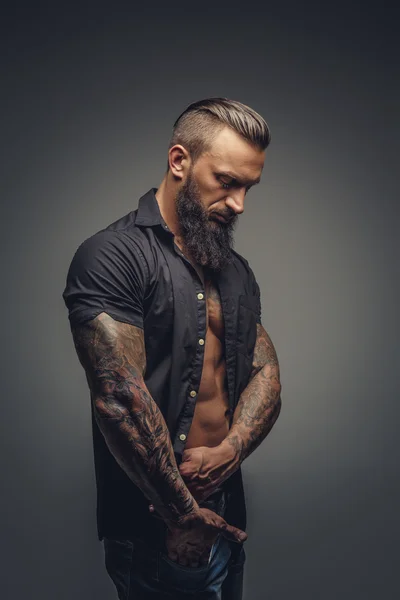 Tattooed male in black shirt