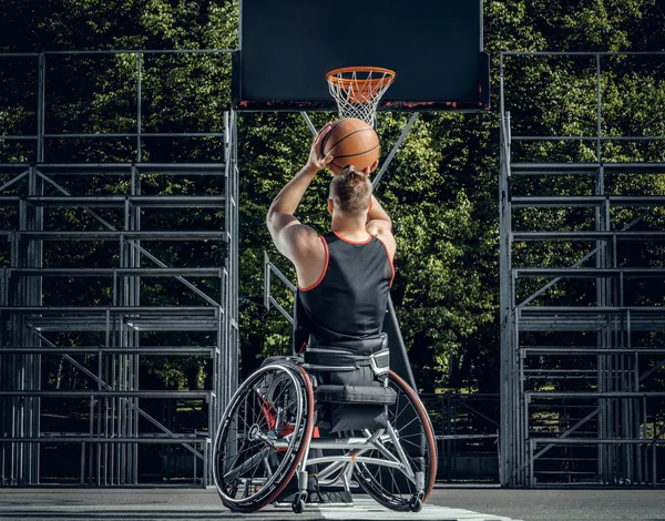Cripple basketball player in wheelchair