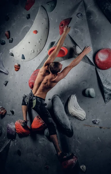 Man climbing on an indoor climbing wall