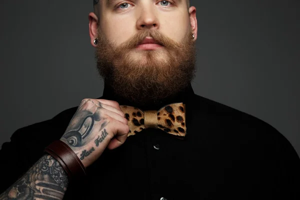 Man in black shirt and bow tie.