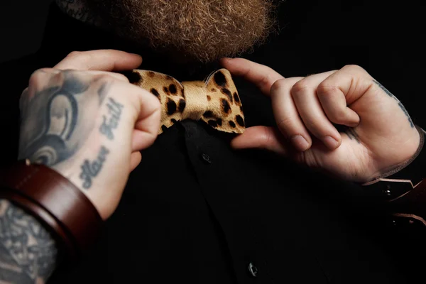 Man in black shirt and bow tie.