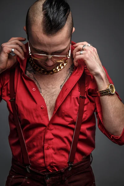 Male in red t shirt in studio.