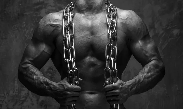 Muscular young man with chain.