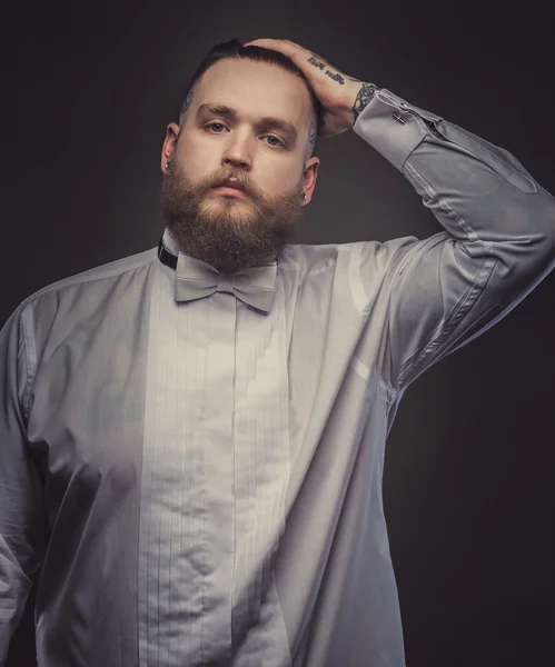 Serious man in white shirt