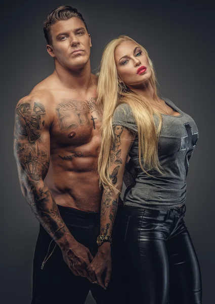 Man and woman with tattoos