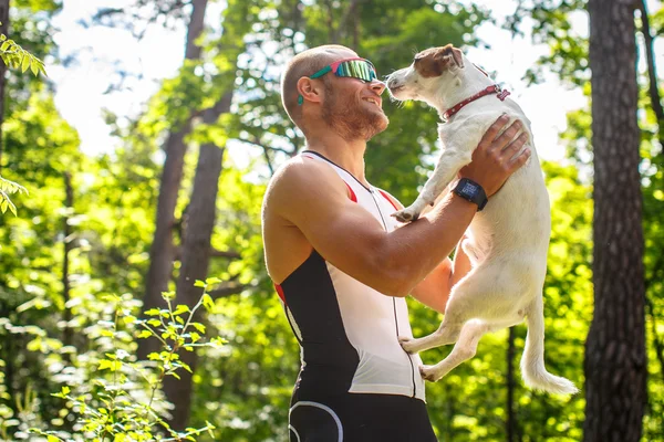 Man holding his dog.