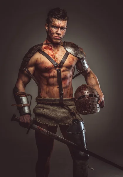 Muscular bloody gladiator