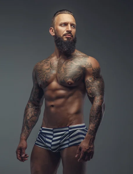 Tattooed muscular man