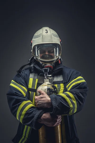 Firefighter in helmet and mask