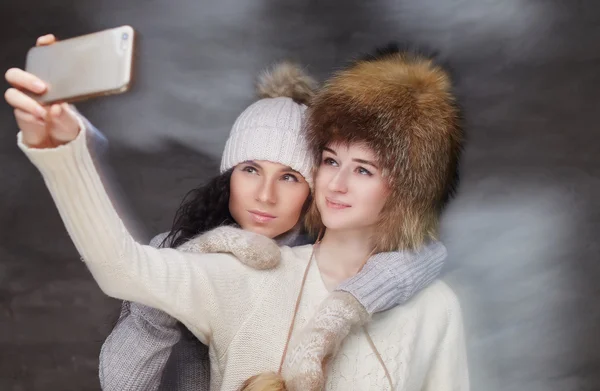 Two women in winter clothes.