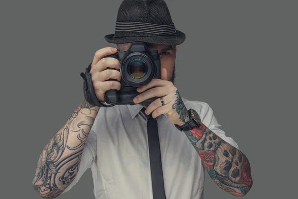 A man with tattooes on arms