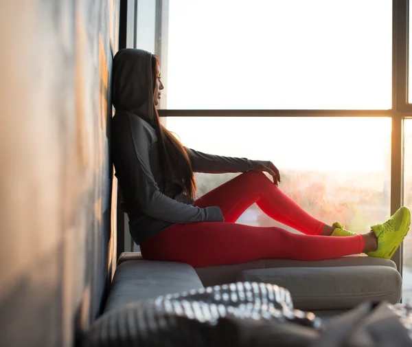 Woman in red sports pants.