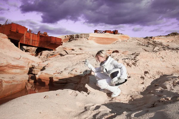 Futuristic astronaut on another planet, Mars. image with the effect of toning