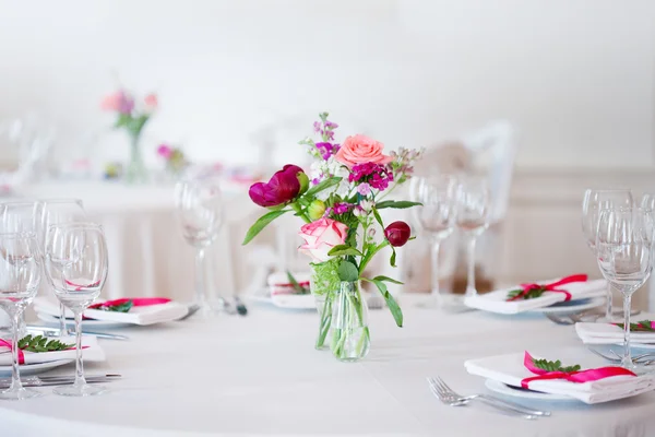 Wedding banquet, small restaurant floral, decor in red, informal style.