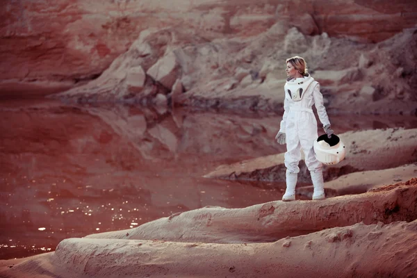 Futuristic astronaut on another planet, image with the effect of toning