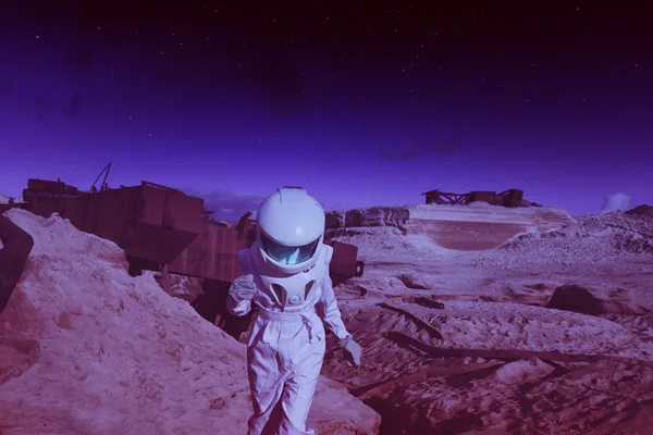 Futuristic astronaut on another planet, Mars. image with the effect of toning