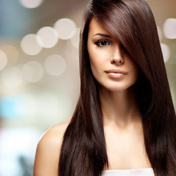 Woman with long straight brown hair
